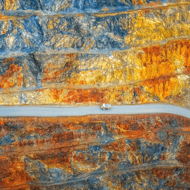 RUYI Jewelry Metal element imagery, raw mineral quarry symbolizing Geng Metal's unrefined structural strength