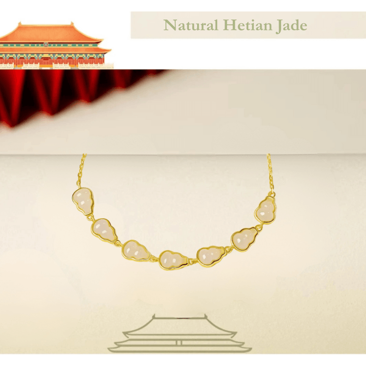 RUYI Jewelry material detail: hulu-shaped white Hetian Jade beads, showcasing the jade's smooth texture and pure white color. White jade represents the Metal element, associated with clarity and strength.